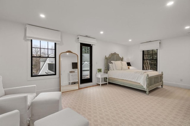 carpeted bedroom with recessed lighting, baseboards, and access to outside