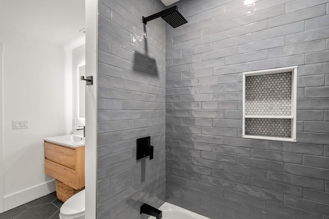 full bathroom featuring tile patterned flooring, baseboards, shower / washtub combination, toilet, and vanity