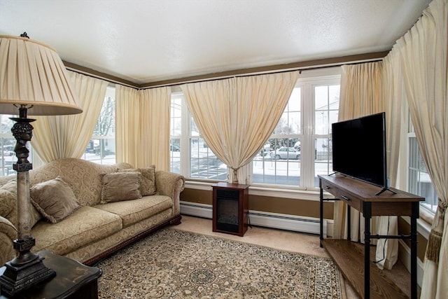 carpeted living room with a baseboard heating unit