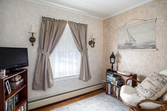 living area featuring ornamental molding, light hardwood / wood-style floors, and a baseboard heating unit