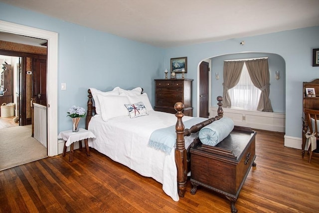 bedroom featuring dark hardwood / wood-style flooring