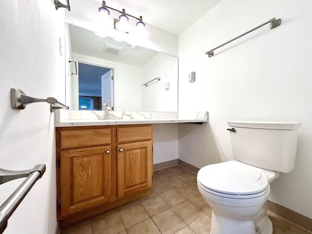 194 Captain Eames Cir Unit 194, Ashland, MA 01721 - bathroom with toilet, vanity, tile patterned flooring, and baseboards