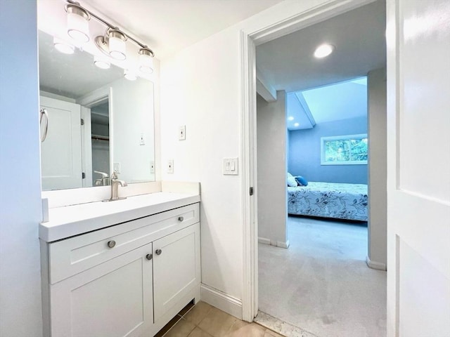 194 Captain Eames Cir Unit 194, Ashland, MA 01721 - bathroom featuring vanity, connected bathroom, baseboards, and tile patterned floors