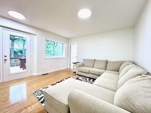 194 Captain Eames Cir Unit 194, Ashland, MA 01721 - living room featuring wood finished floors and baseboards