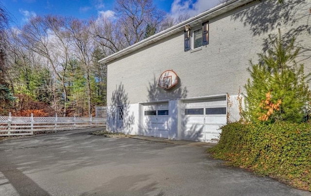 view of side of property featuring a garage