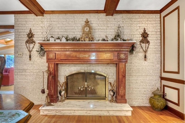 interior details with beam ceiling and hardwood / wood-style floors