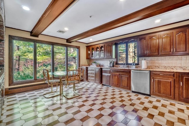 kitchen with beam ceiling, light stone counters, tasteful backsplash, and stainless steel dishwasher