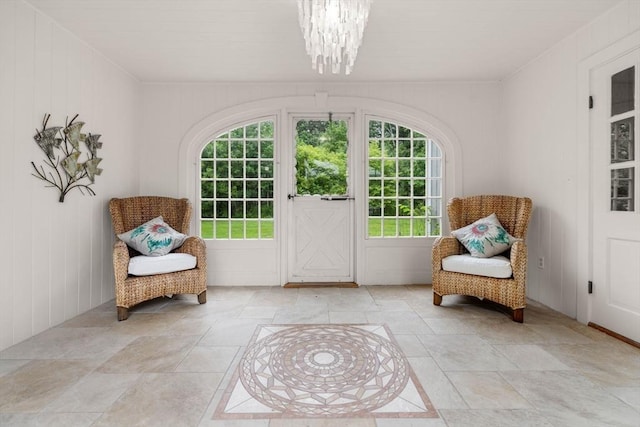 1857 Great Pond Rd, North Andover, MA 01845 - living area featuring plenty of natural light, a chandelier, and stone tile floors