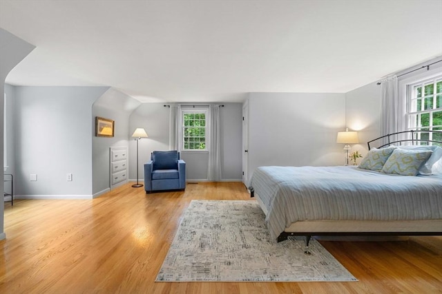 1857 Great Pond Rd, North Andover, MA 01845 - bedroom with light wood-style flooring and multiple windows
