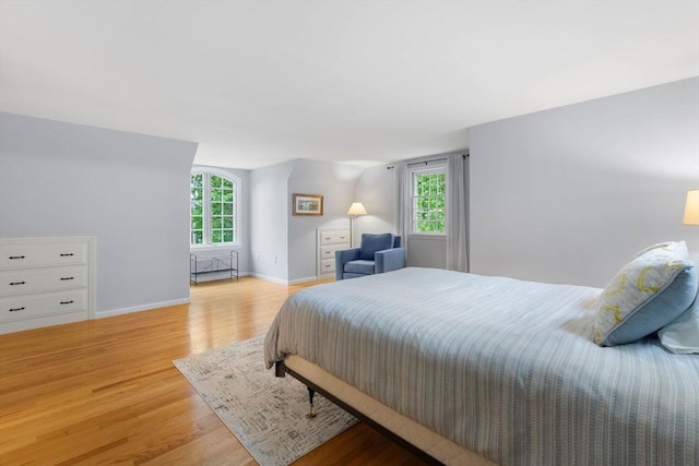 1857 Great Pond Rd, North Andover, MA 01845 - bedroom featuring light wood-style flooring and multiple windows