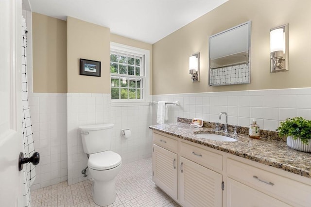 1857 Great Pond Rd, North Andover, MA 01845 - bathroom with vanity, tile walls, wainscoting, and tile patterned flooring