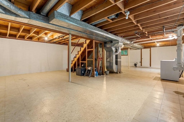 1857 Great Pond Rd, North Andover, MA 01845 - unfinished basement with washer / clothes dryer, stairway, heating unit, and tile patterned floors