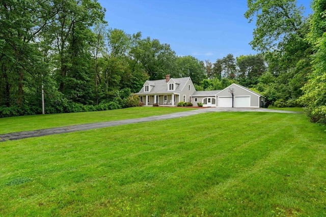 1857 Great Pond Rd, North Andover, MA 01845 - view of front facade with driveway, a garage, a front lawn, covered porch, and a chimney