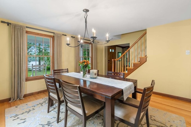 1857 Great Pond Rd, North Andover, MA 01845 - dining space with a chandelier, healthy amount of natural light, light wood-style floors, and stairs