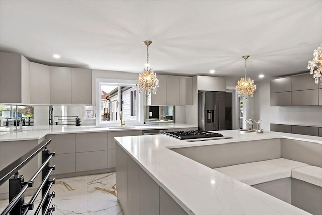 23 Donna St, Westport, MA 02790 - kitchen featuring appliances with stainless steel finishes, a chandelier, modern cabinets, a sink, and plenty of natural light