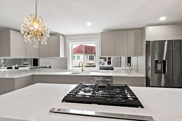 23 Donna St, Westport, MA 02790 - kitchen featuring a sink, stainless steel appliances, modern cabinets, gray cabinets, and a chandelier