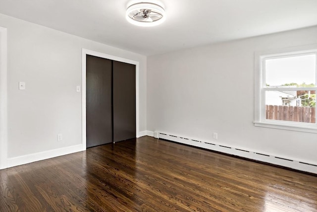 23 Donna St, Westport, MA 02790 - unfurnished bedroom featuring a baseboard radiator, wood finished floors, a closet, and baseboards