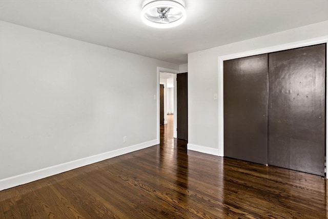 23 Donna St, Westport, MA 02790 - unfurnished bedroom with baseboards, dark wood-style floors, and a closet