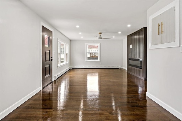 23 Donna St, Westport, MA 02790 - spare room featuring a ceiling fan, recessed lighting, wood finished floors, baseboards, and heating unit