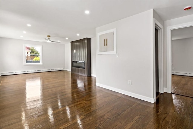 23 Donna St, Westport, MA 02790 - unfurnished living room with a baseboard heating unit, recessed lighting, ceiling fan, wood finished floors, and baseboards