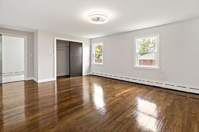 23 Donna St, Westport, MA 02790 - unfurnished bedroom featuring baseboard heating, wood finished floors, a closet, and baseboards