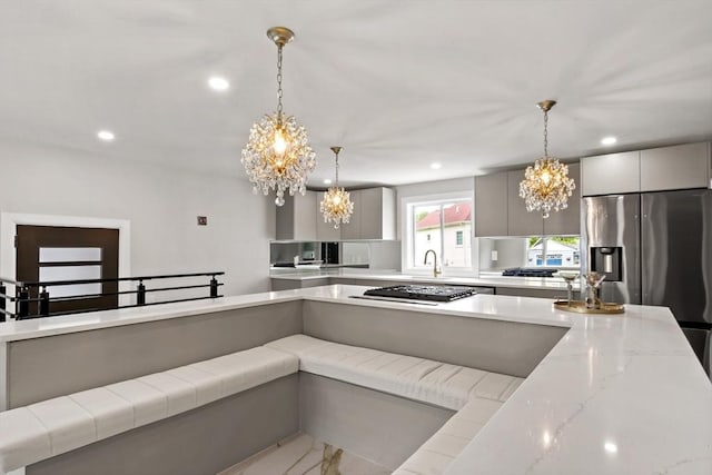 23 Donna St, Westport, MA 02790 - kitchen with a chandelier, appliances with stainless steel finishes, pendant lighting, recessed lighting, and light stone countertops