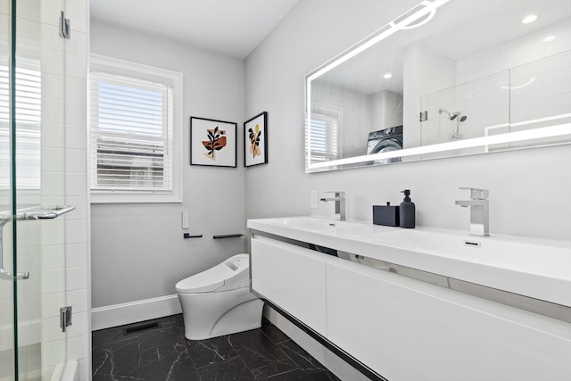 bathroom with vanity, toilet, and a shower with door