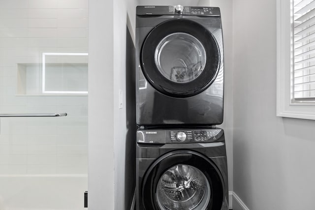 laundry room featuring stacked washer and dryer