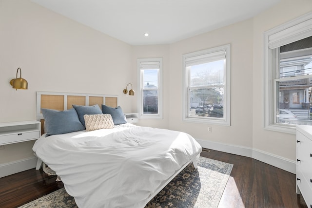 bedroom with dark wood-type flooring