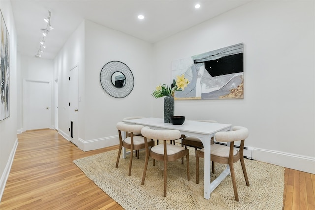 dining room with hardwood / wood-style floors