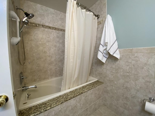 full bath featuring tiled shower / bath