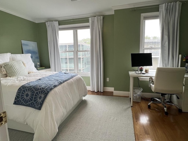 239 Prospect St Unit 241-3, Cambridge, MA 02139 - bedroom with crown molding, wood finished floors, baseboards, and an office area