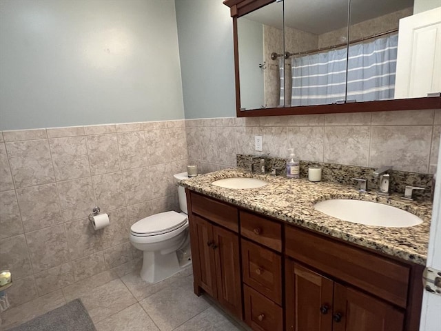 239 Prospect St Unit 241-3, Cambridge, MA 02139 - full bathroom featuring double vanity, a shower with curtain, tile walls, toilet, and tile patterned floors