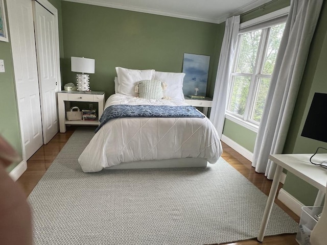 239 Prospect St Unit 241-3, Cambridge, MA 02139 - bedroom with multiple windows, baseboards, crown molding, and dark wood finished floors