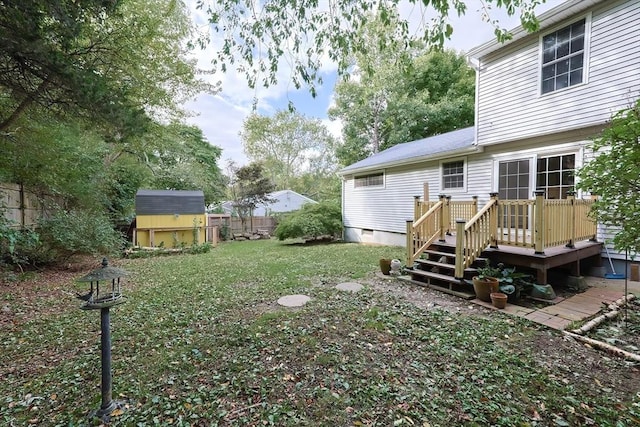 118 Coolidge St, Swansea, MA 02777 - view of yard with a storage unit and a wooden deck
