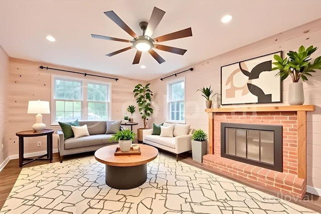 118 Coolidge St, Swansea, MA 02777 - living room featuring healthy amount of natural light, wood finished floors, a fireplace, a ceiling fan, and recessed lighting