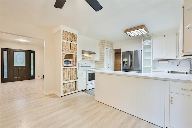 118 Coolidge St, Swansea, MA 02777 - kitchen with white electric range oven, stainless steel fridge, open shelves, and tasteful backsplash