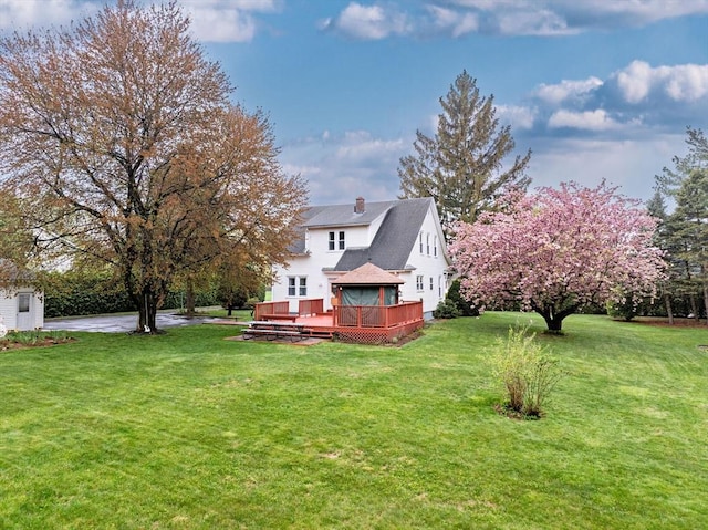 view of yard featuring a wooden deck