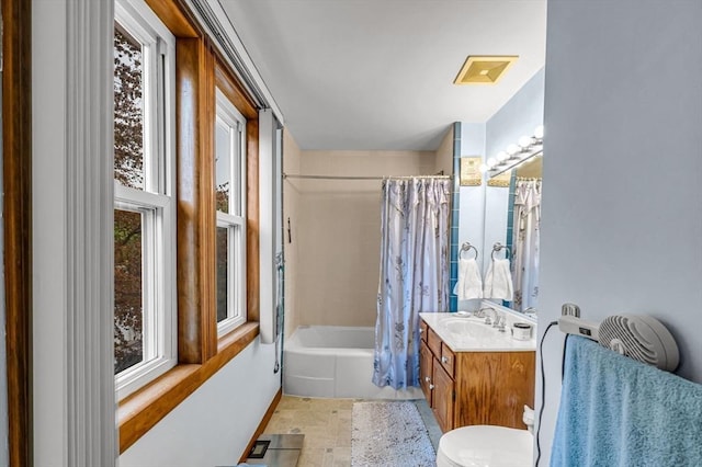 bathroom with toilet, vanity, and shower / bathtub combination with curtain