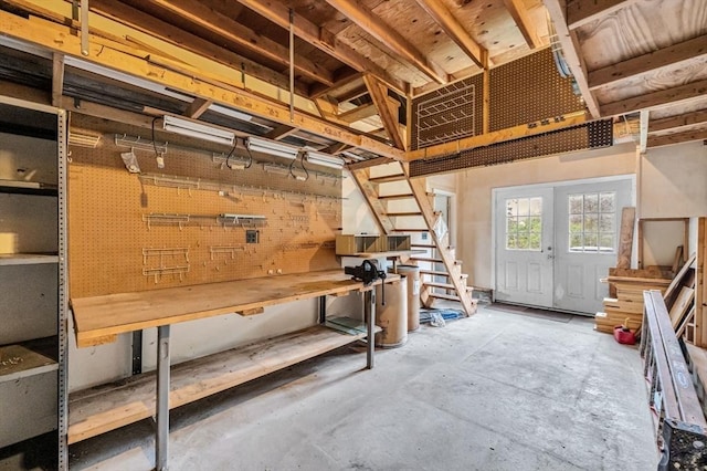 below grade area featuring a workshop area and stairs