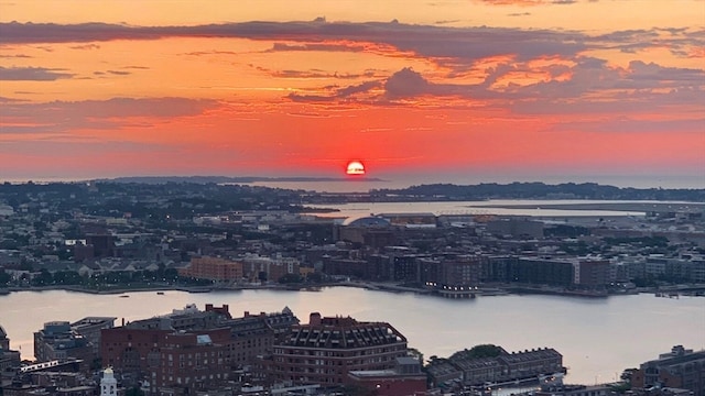 aerial view at dusk with a water view