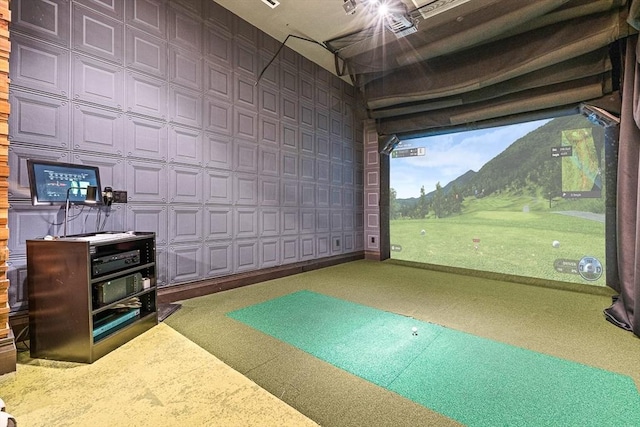 rec room with golf simulator