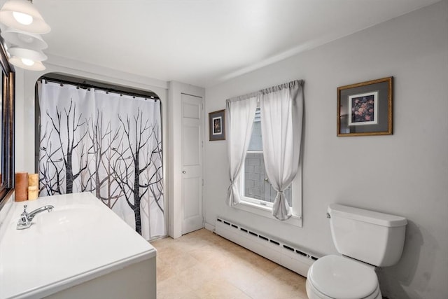 24 Webber Rd, Brookfield, MA 01506 - bathroom featuring a baseboard heating unit, vanity, toilet, and tile patterned floors