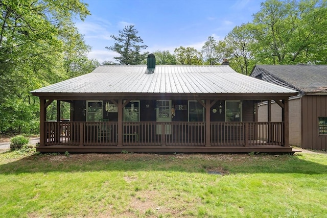 24 Webber Rd, Brookfield, MA 01506 - back of property featuring a lawn, a chimney, and metal roof