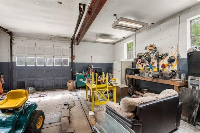 24 Webber Rd, Brookfield, MA 01506 - garage with concrete block wall and freestanding refrigerator