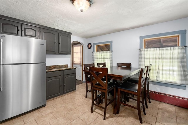 24 Webber Rd, Brookfield, MA 01506 - dining space with arched walkways and a textured ceiling