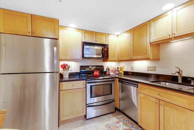 51 Melrose St Unit 5A, Melrose, MA 02176 - kitchen with stainless steel appliances, dark countertops, and recessed lighting