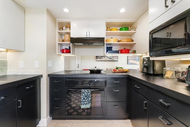 kitchen featuring black appliances, open shelves, under cabinet range hood, white cabinets, and dark countertops