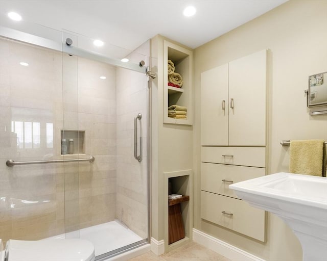 bathroom featuring a shower stall, recessed lighting, and toilet