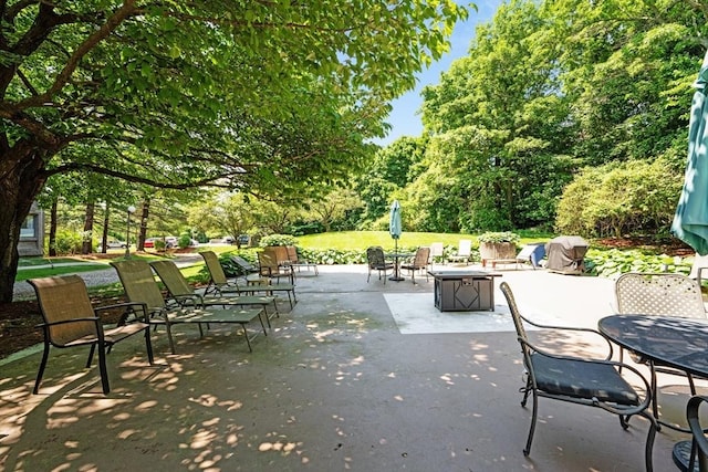 view of patio with view of wooded area